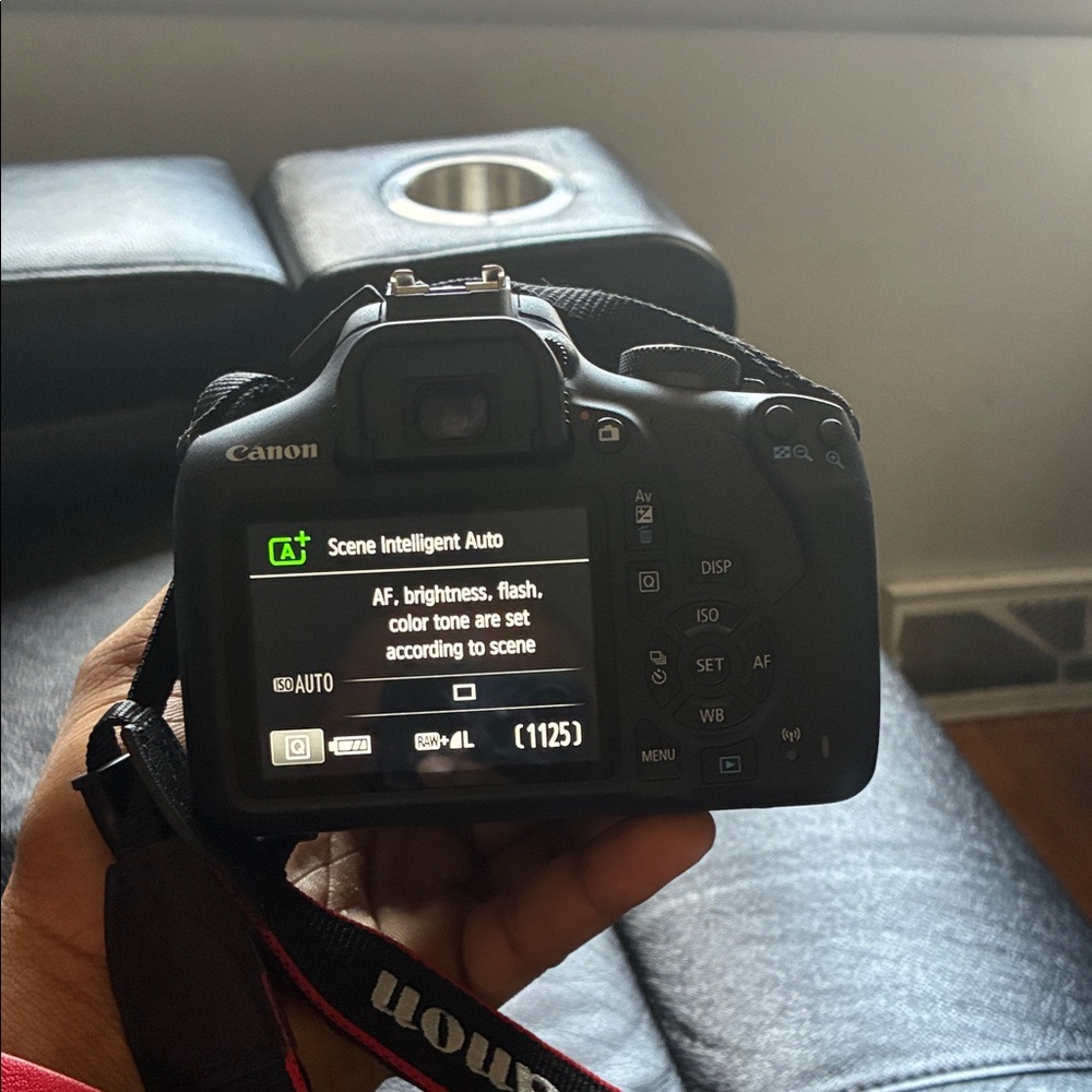 Canon DSLR Camera in Black with Red-Trim Strap